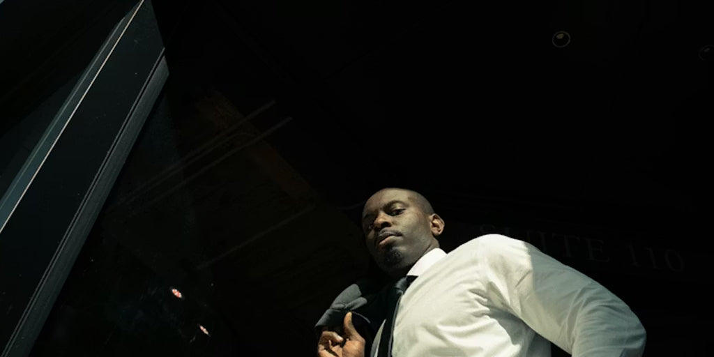 a black man with a tie on