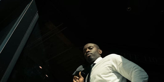 a black man with a tie on