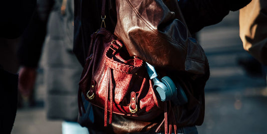 a lady wearing a leather crossbody bag
