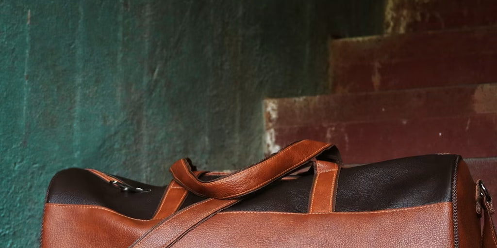 a leather bag beside a wall
