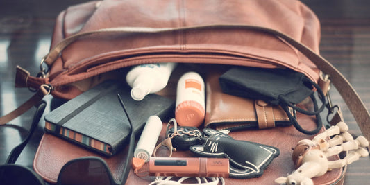 a leather organizer bag on a desk