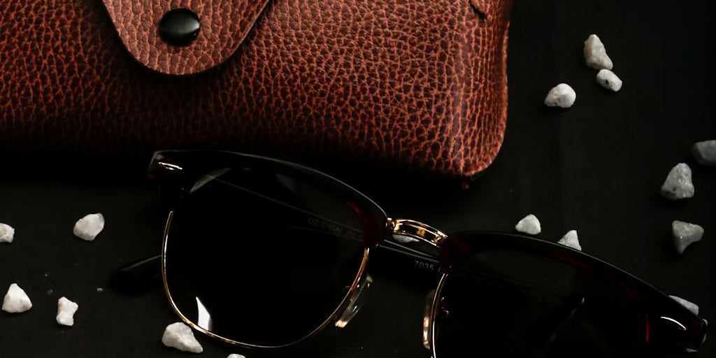 a leather sunglasses case and a pair of sunglasses