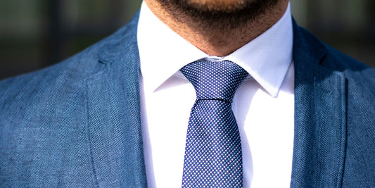 a man and a well dressed  tie