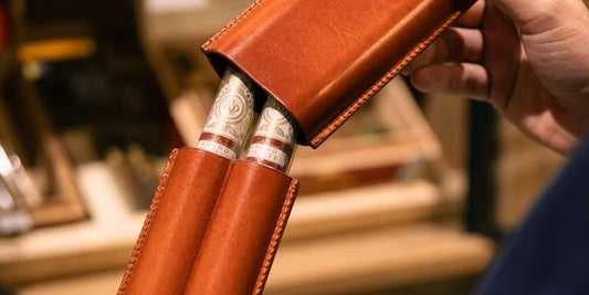 a man is opening a leather cigar case