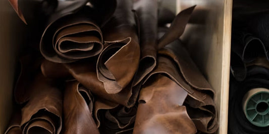 a pile of full-grain leather on a shelf