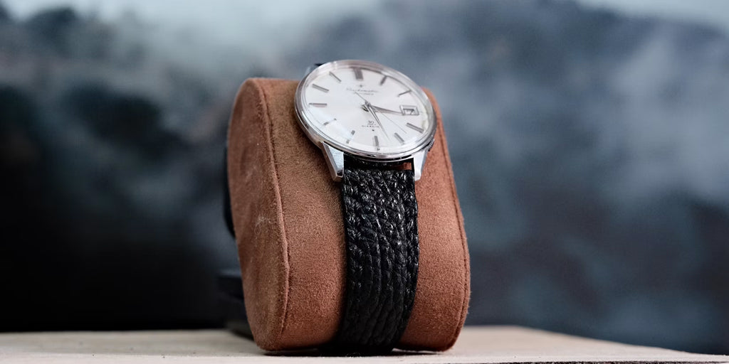 a watch is set into a watch case pillar