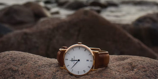 a watch on a rock