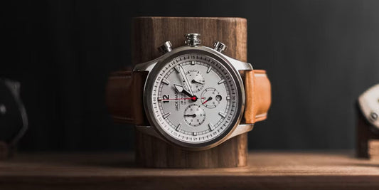 a watch set to a wood watch roll