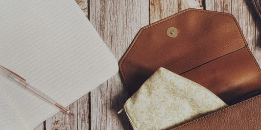 an open leather clutch on a desk