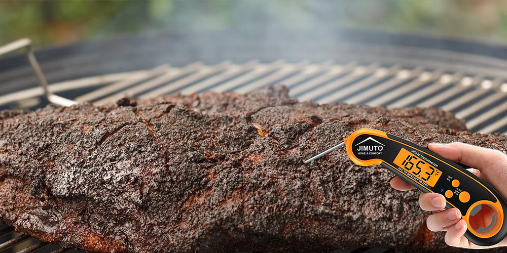 a professional uses a digital meat thermometer to grill a brisket steak