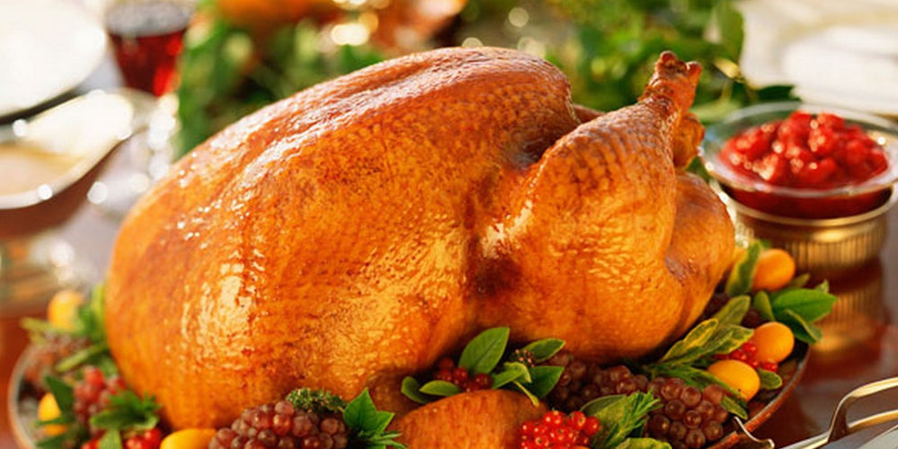 a well grilled turkey on a desk to show how to grill turkey