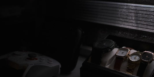 three pieces of watches stored in a leather box