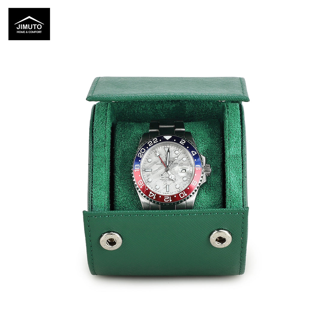 Watch with a colorful face in a green leather watch box on a white background