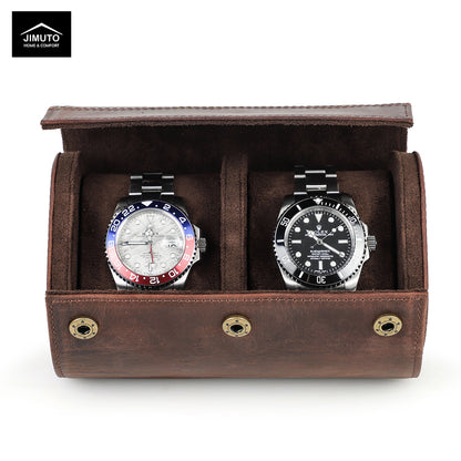 Two watches in a brown leather watch display case with JIMUTO branding.