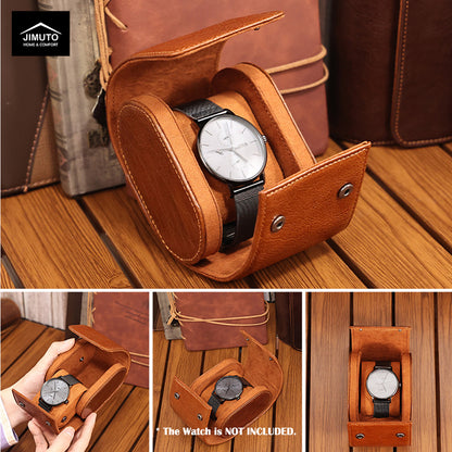 Brown leather watch box with a watch inside, placed on a wooden surface.