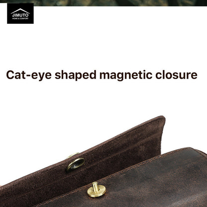 Brown leather tie roll with cat-eye shaped magnetic closure on a white background, featuring Jimuto logo.