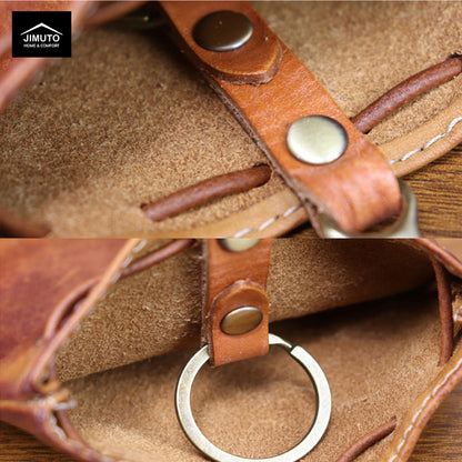 Close-up of a brown leather strap with metal rings on a textured surface, featuring the Mimuto brand.