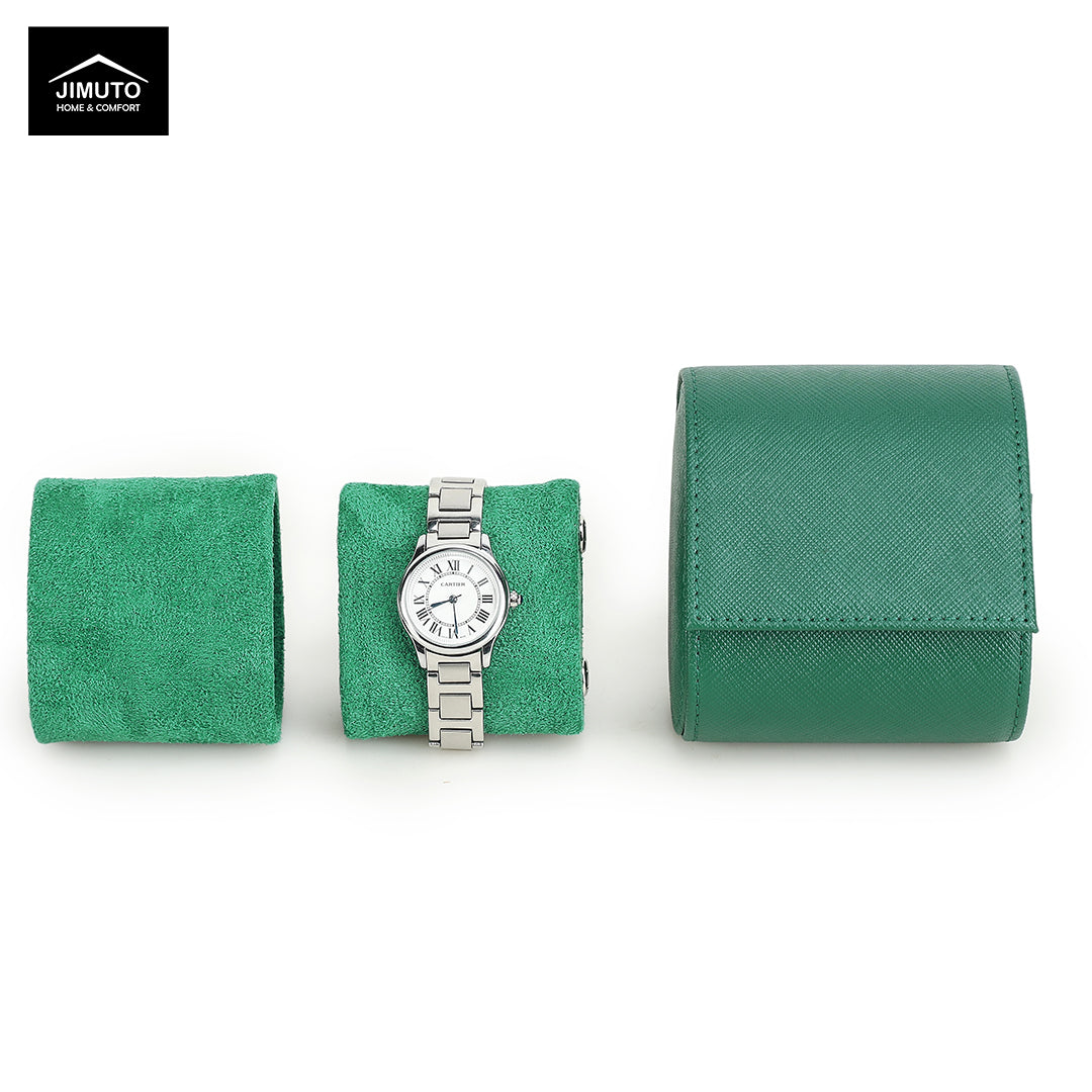 Green saffiano leather watch box with a silver watch on a white background