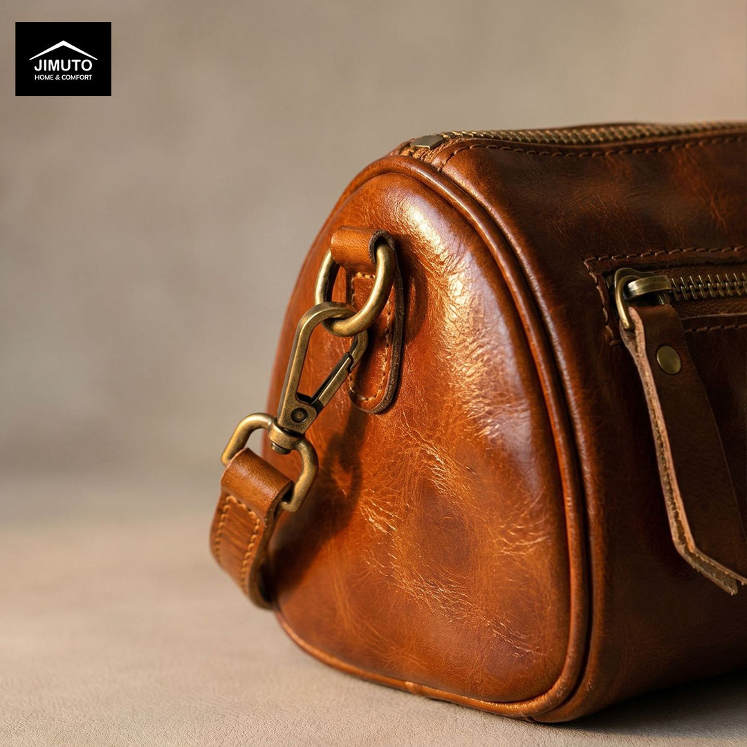 Brown leather cosmetic and storage bag with brass hardware on a beige background, featuring the JIMUTO brand.
