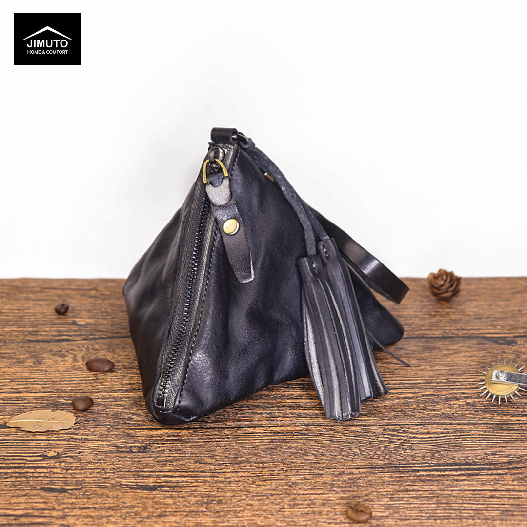 Black Genuine Leather Clutch with zipper on a wooden surface, featuring the JIMUTO brand.