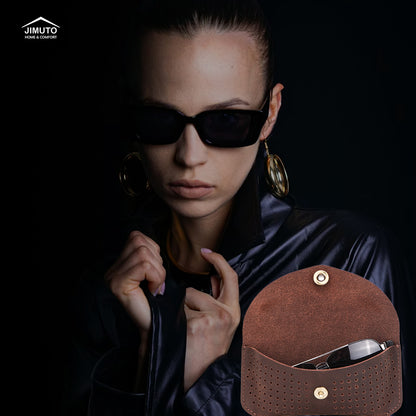 Woman wearing sunglasses with a brown leather sunglasses case.