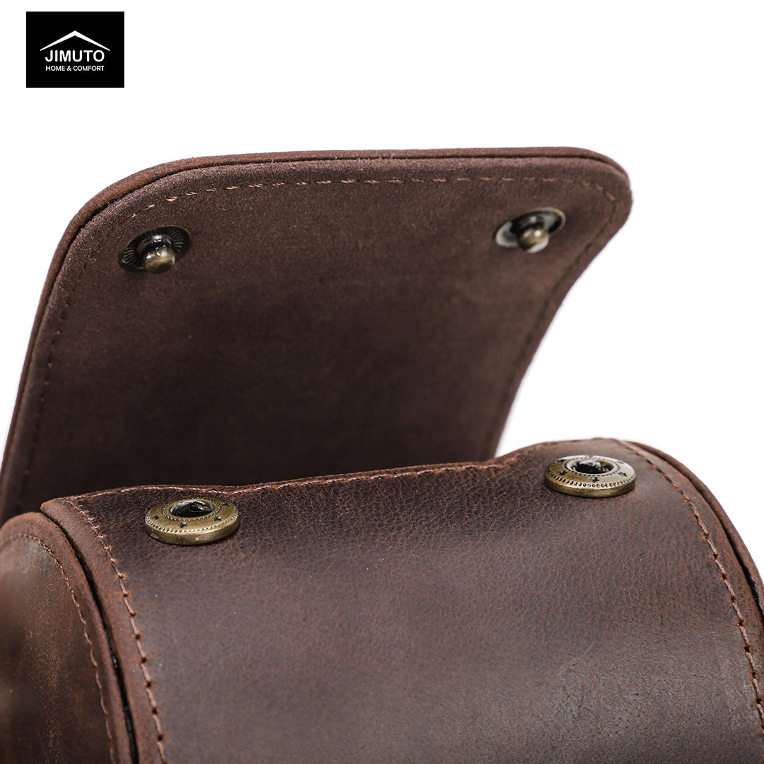 Close-up of a brown leather watch roll with gold rivets, featuring the Jimuto brand logo.