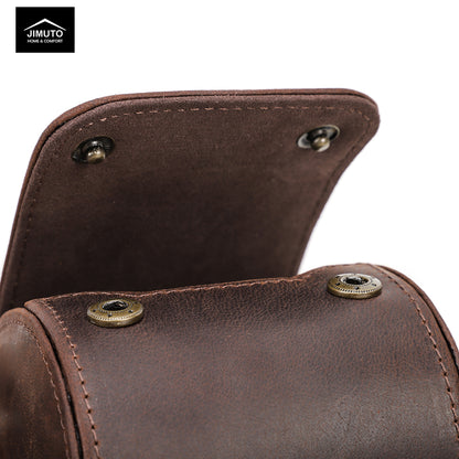 Close-up of a brown leather watch roll with gold rivets, featuring the Jimuto brand logo.