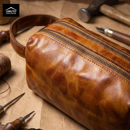 Brown leather cosmetic bag with tools on a textured surface, featuring JIMUTO branding.