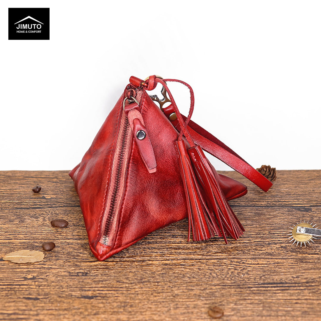 Wine Red Genuine Leather Clutch bag with tassels on a wooden surface, featuring the JIMUTO brand.