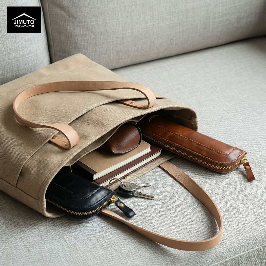 Beige tote bag with brown accents on a gray surface, featuring the JIMUTO brand.