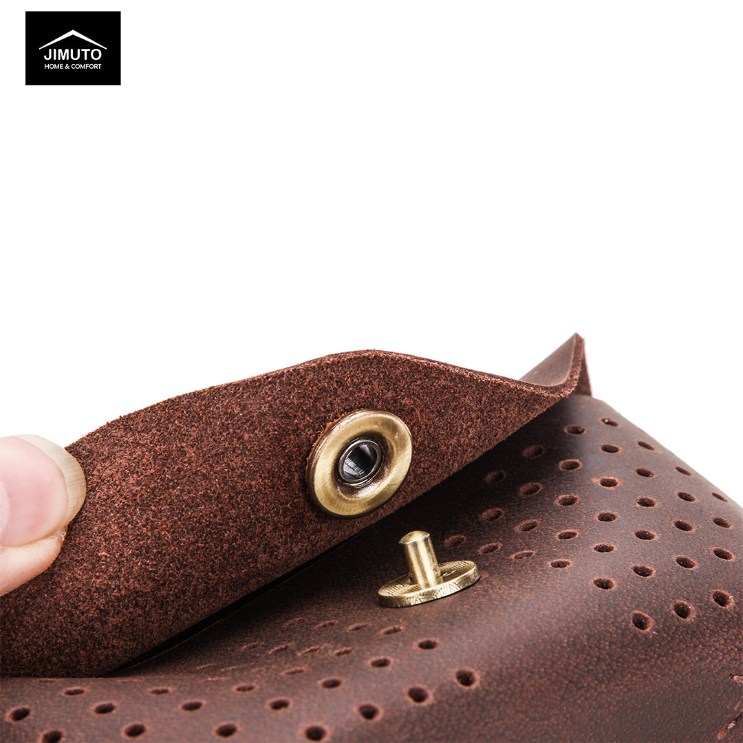 Brown leather eyeglasses case with gold buttons held by a hand, brand 'JIMUTO' visible.