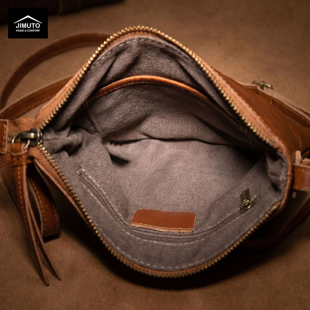 Open leather bag with visible brand logo on a brown background