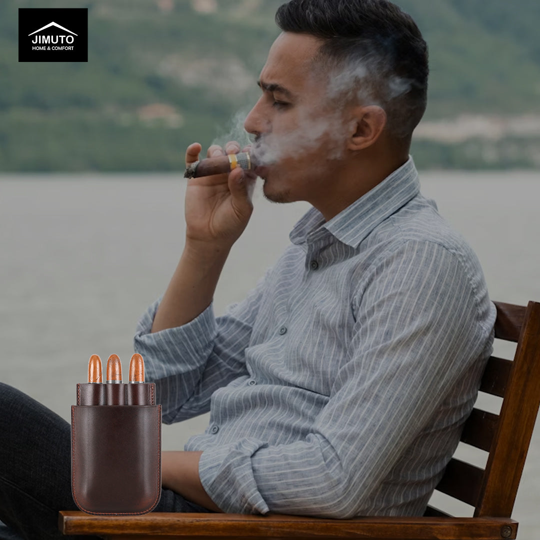 Man smoking a cigar with a scenic background, next to a leather cigar case.