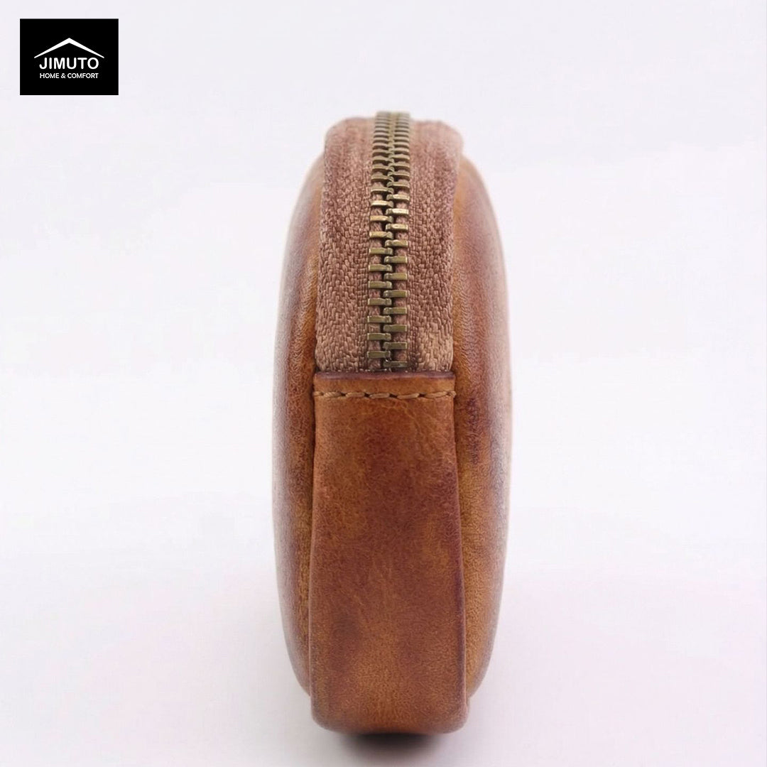Brown leather coin purse with gold zipper on a white background, featuring the JIMUTO brand.