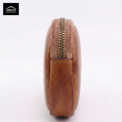 Brown leather coin purse with gold zipper on a white background, featuring the JIMUTO brand.