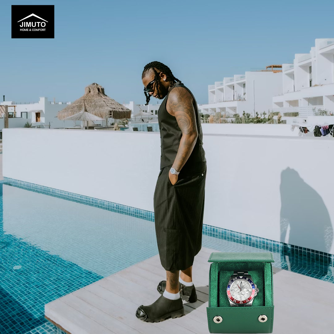 Man standing by a pool with a watch in a saffiano leather watch box, JIMUTO logo visible