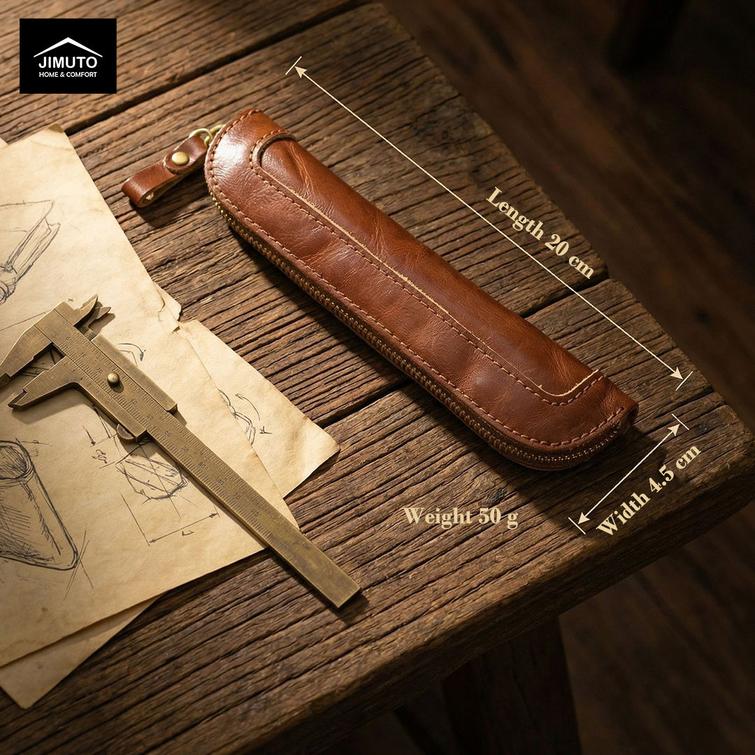Brown leather pen case on a wooden surface with measurements and JIMUTO branding.