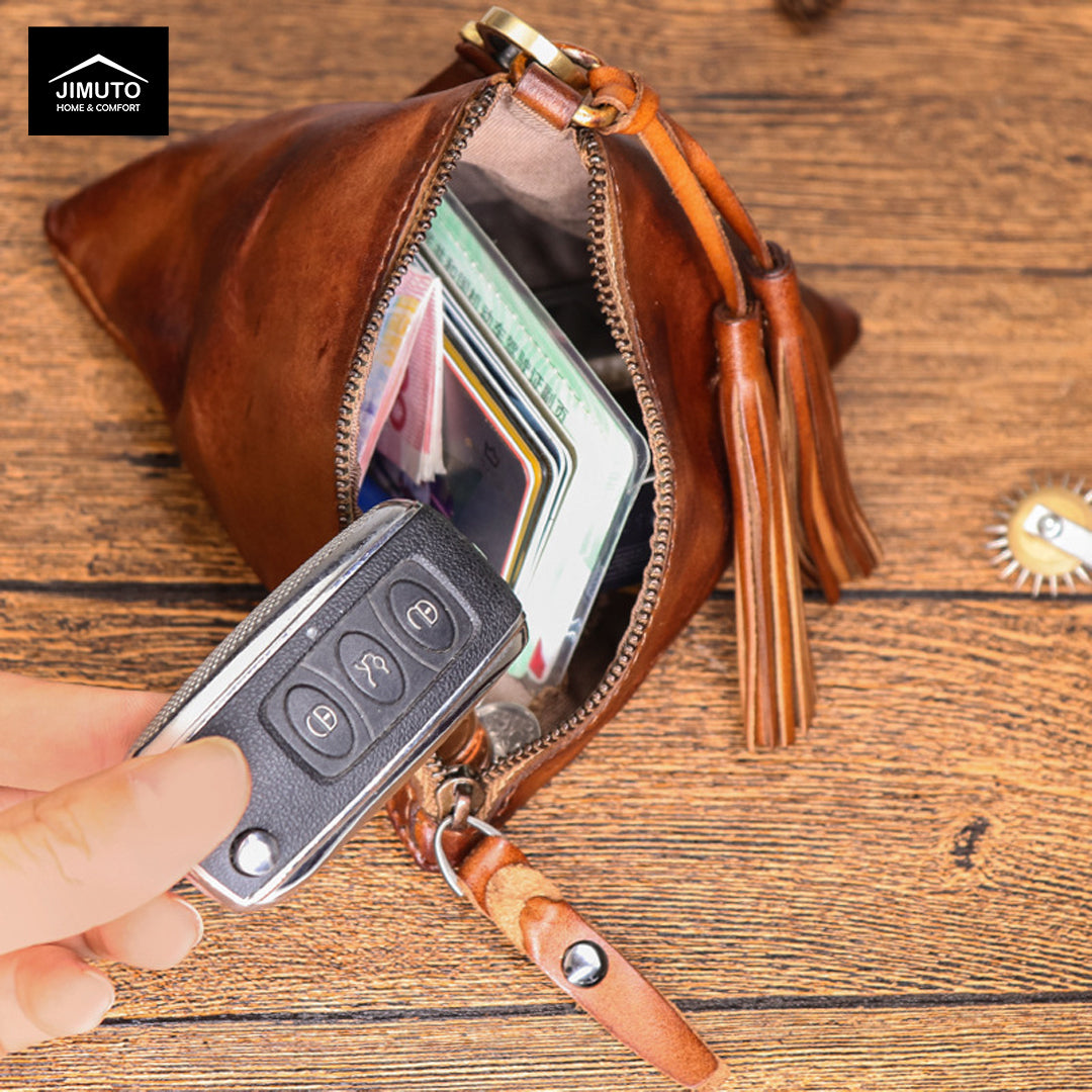 Brown leather wallet with a car key fob on a wooden surface, featuring the JIMUTO brand.