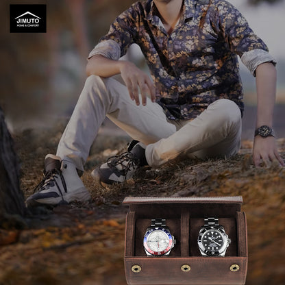 Person sitting outdoors with two watches in a leather watch case in the foreground