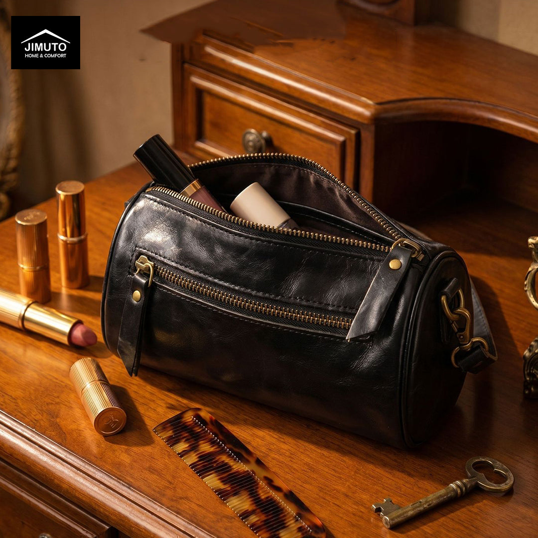 Black leather cosmetic and storage bag with makeup items on a wooden surface, featuring the JIMUTO brand.