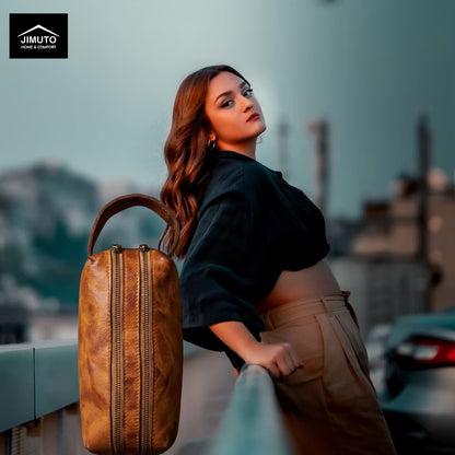 Woman with a brown leather cosmetic bag against an urban background
