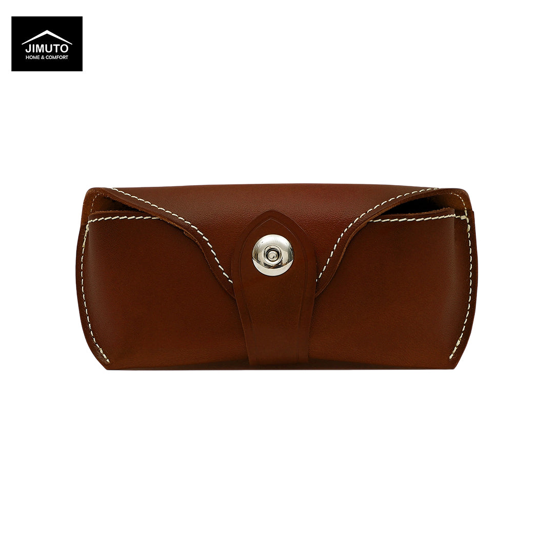 A red brown leather eyeglasses case with white contrast stitching and a silver snap button closure, shown on a plain white background. The Jimuto logo is visible in the top-left corner.