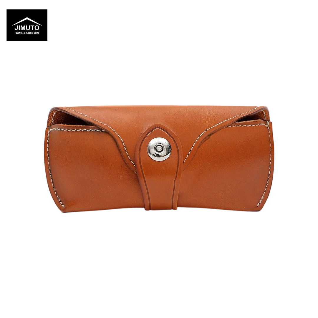 A yellow brown leather eyeglasses case with white contrast stitching and a silver snap button closure, shown on a plain white background with a Jimuto brand logo in the top-left corner.