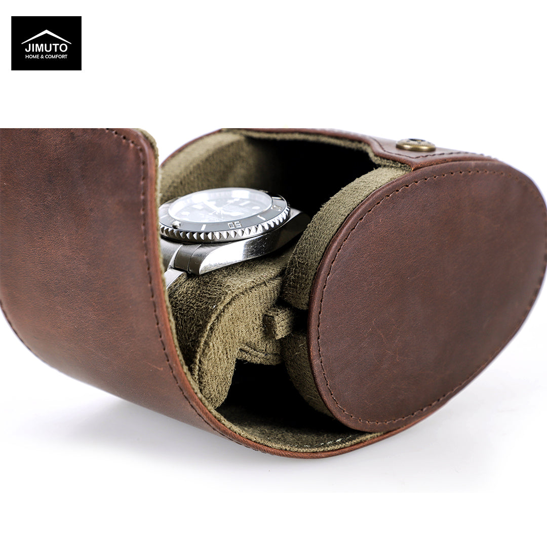 A brown leather watch case with an olive green interior, shown open with a silver wristwatch inside. The Jimuto brand logo is visible in the top-left corner.