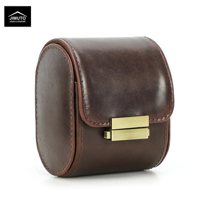 A dark brown leather watch box with a front flap and a gold-tone metal clasp, shown on a white background with a Jimuto brand logo in the top-left corner.