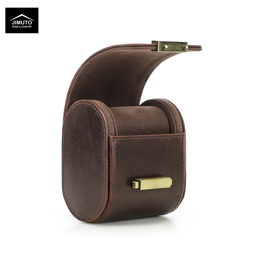 A dark brown full-grain leather watch box with a curved lid and brass-tone hardware, shown on a clean white background. The Jimuto brand logo is visible in the top-left corner.