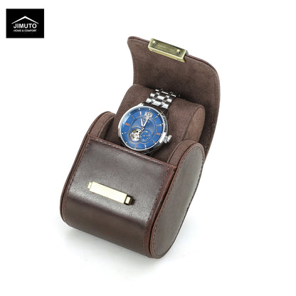 A brown full-grain leather watch presentation case with a blue dial wristwatch displayed inside, shown on a white background with a Jimuto brand logo in the top-left corner.