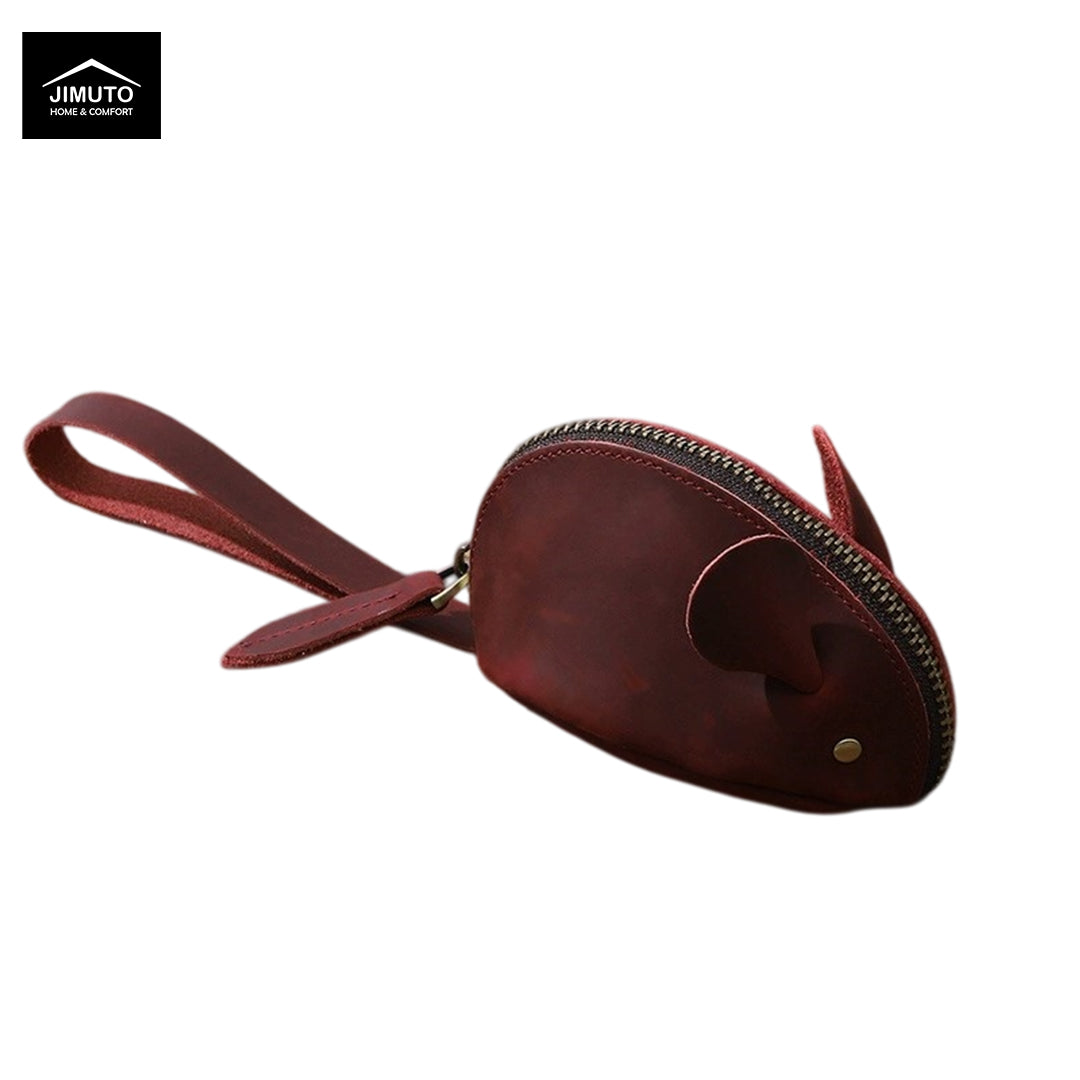 A dark reddish-brown leather mouse-shaped zippered pouch with a wrist strap, shown on a plain white background. A black logo for 'JIMUTO' is visible in the top-left corner.