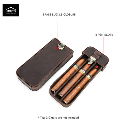 A dark brown leather cigar case shown open on a white background, with two closed cases and overlaid callouts reading 'BRASS BUCKLE CLOSURE' and '3 PEN SLOTS'. A Jimuto logo appears in the top-left corner, and a tip note at the bottom says the three cigars are not included.