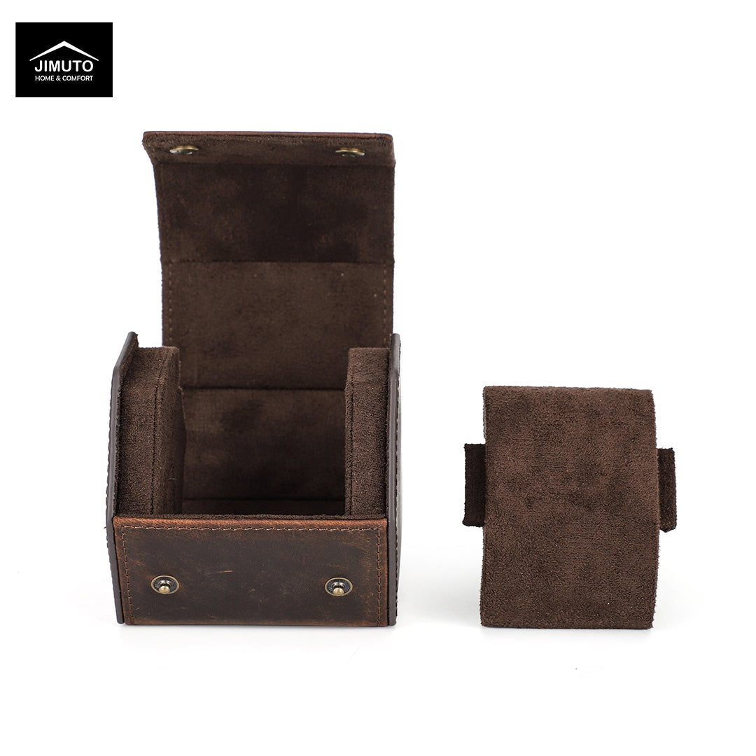 A dark brown hexagonal leather watch box shown open with its interior compartments visible, alongside the matching closed exterior pouch on a white background. A Jimuto brand logo is visible in the top-left corner.